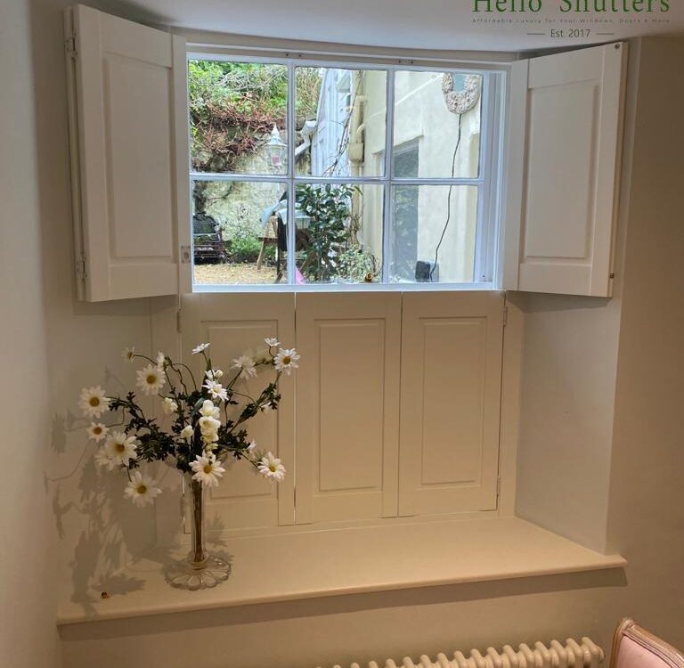 Traditional timber panel window shutters