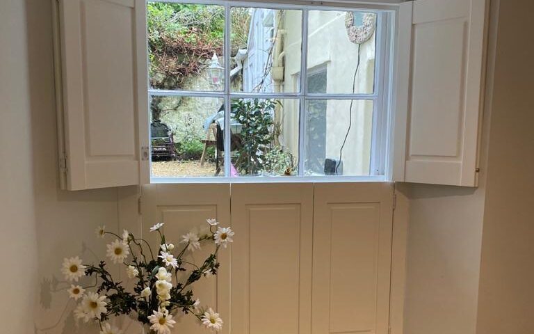 Traditional timber panel window shutters