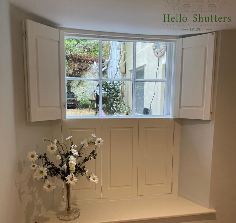 Traditional timber panel window shutters